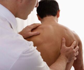 A neurologist examines a patient with signs of cervical osteochondrosis.